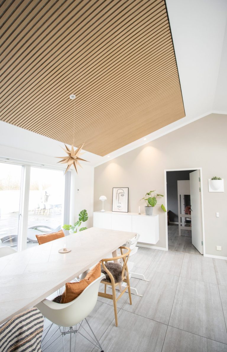 How a Wood-Slatted Ceiling Enhances the Ambiance of Your